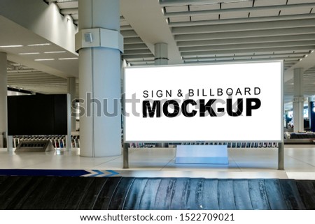 Perspective mock up blank large horizontal billboard with clipping path at baggage claim point in airport terminal, empty space for advertising or public information, advertisement concept