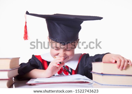 Funny portrait of cute child girl student master. Humorous photo. Knowledge, studies, work, career concept.