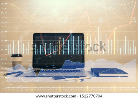 Forex graph hologram with desktop office computer background. Double exposure. Concept of financial analysis.