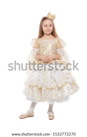 Little perfect blonde girl in a princess costume posing in the studio on an isolated background