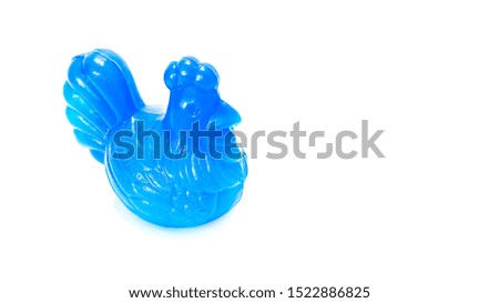 Isolated Blue plastic chicken piggy bank in perspective view on white background 