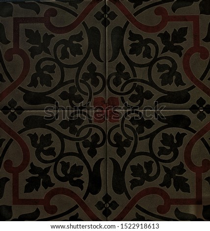 Ceramic tiles with geometric pattern. Texture for wall and floor design. Black pattern with floral ornament.