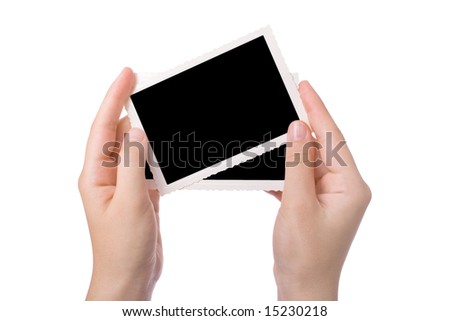 Hands holding a photograph isolated on a white background
