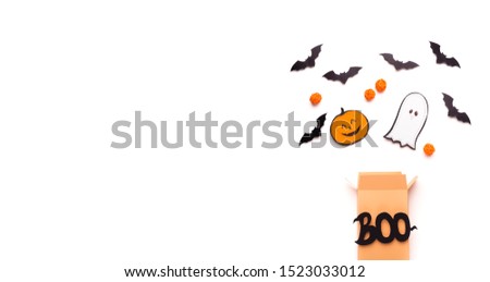 Banner template. Halloween creative background with candies and figures flying out of the boo box, copy space, panorama