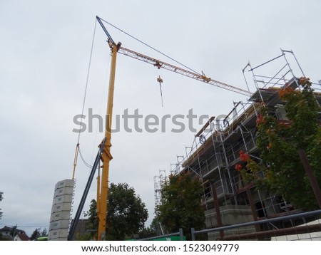 In the evening work stops, the crane stands near the building