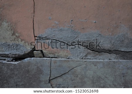 Cracked wall. Brick wall. Ancient brick pair.