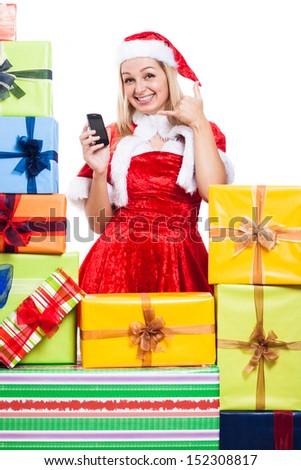 Happy woman in Christmas costume going to call you, isolated on white background.