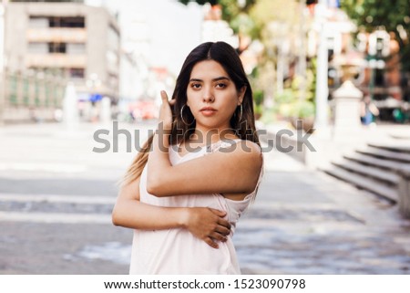 Mexican latin woman, portrait of pretty young and student girl in Mexico city