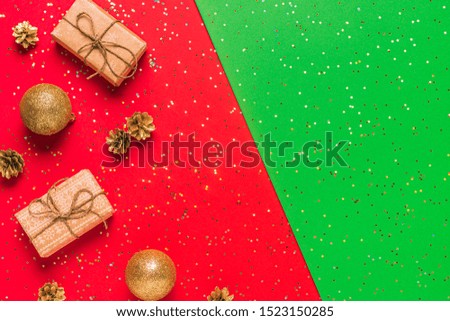 Christmas composition on a red, green background. Flat lay, top view, copy space