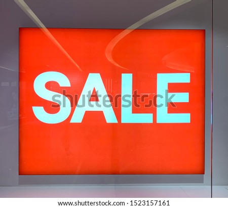 sale banner in glass cabinets