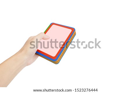 hand of asian man is hold the colorful paper card notebook isolated on white background