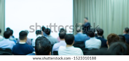 Conference photo audience and tech speaker giving speech. Seminar presenter at CEO forum. Corporate manager in executive training discussion on stage. Investor pitch presentation workshop picture.
