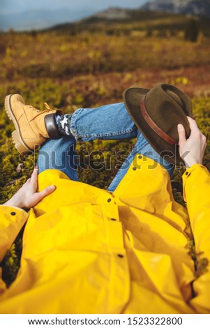 Young man lying on the mountains, enjoying the beauty, close up cropped photo