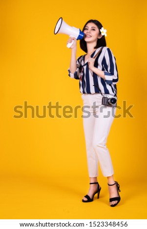 Tourist woman in summer casual clothes.Asian Smiling woman .Passenger traveling abroad to travel on yellow background.Asian woman going to summer vacation.Travel trip funny.