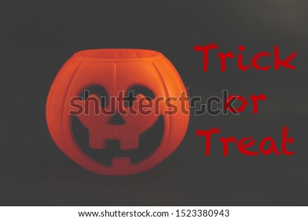 The Halloween pumpkin on dark background with Trick or Treat text