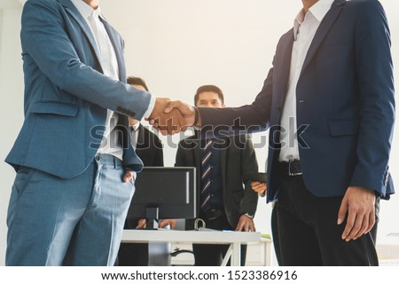 Business team casual meeting and discussing in workplace.