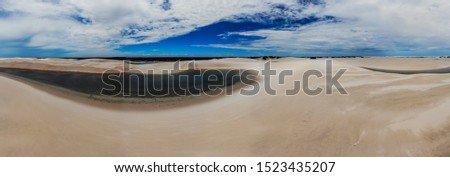 Aerial shot of the sand dunes and lagoons in Brazil, Lencois Maranhenses national park in Maranhao state.Lago azul
