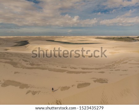 Aerial shot of the sand dunes and lagoons in Brazil, Lencois Maranhenses national park in Maranhao state.Lago azul
