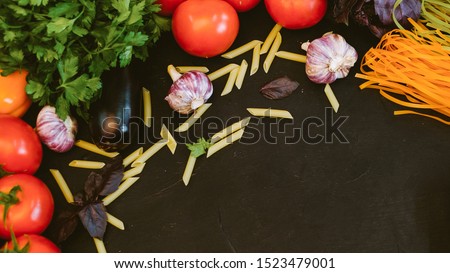 Italian cuisine. Organic food ingredients. Colorful pasta fresh vegetables arrangement.