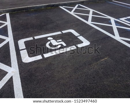 Road markings for the disabled. Disabled parking drawing on the pavement