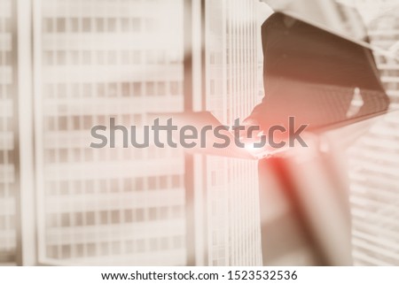 Businessman by the window with laptop