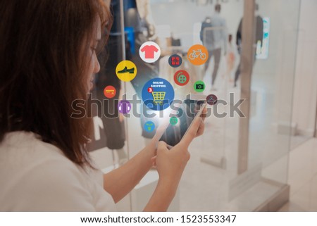 online shopping concept.close-up of business man hands using touch screen smartphone in department store