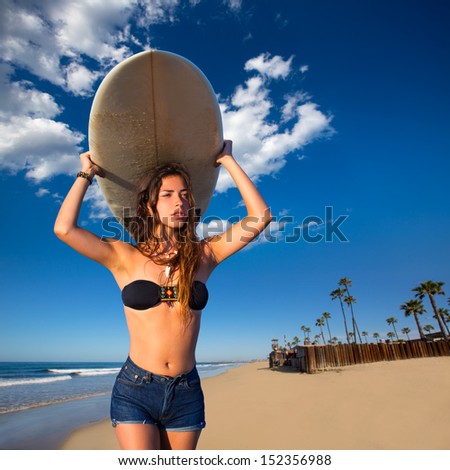 Brunette surfer teen girl holding surfboard in Newport Beach California [ photo-illustration]