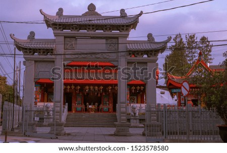 Chinese temple with a big gate at the front of the temple
