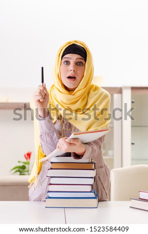 Female student in hijab preparing for exams