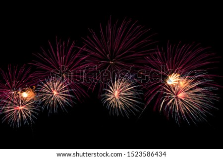 abstract beautiful firework celebration rows on black background