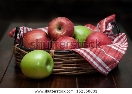 Red and green apples in a basket