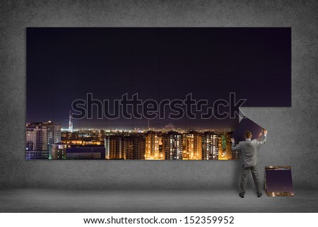businessman collects the image of city ??at night, a place for text