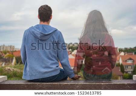 Miss you so much, Left spirit, Remembering you, A man and a transparent woman sitting on a bench Royalty-Free Stock Photo #1523613785