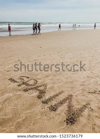 on the sandy beach in the sand the inscription spain is written