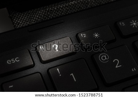 question mark on the keyboard key of a personal computer or laptop close-up macro