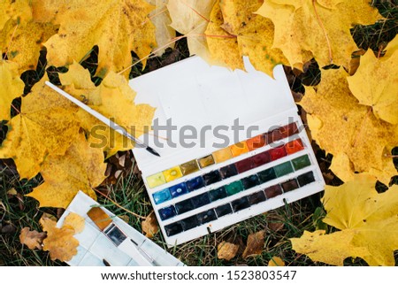 Relax woman painting water colour art work in autumn garden forest nature