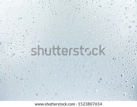 Water drops on glass,white Background and Texture, Rain droplets on glass background.