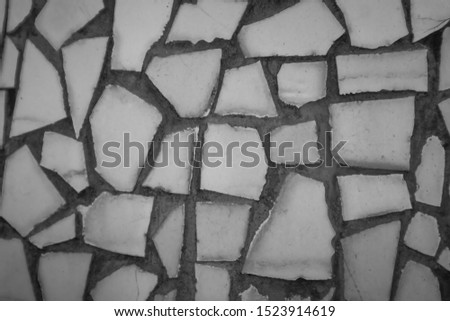 Broken tiles mosaic seamless pattern. Black Dark tile real wall high resolution real photo or brick seamless with texture interior background. Abstract wallpaper irregular in bathroom.