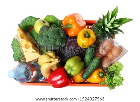 Shopping basket with grocery products on white background, top view Royalty-Free Stock Photo #1524027563