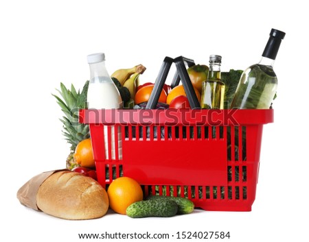 Shopping basket and grocery products on white background Royalty-Free Stock Photo #1524027584