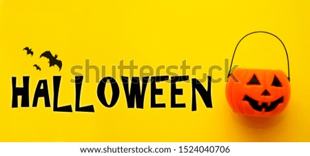 Halloween card with pumpkin and bats