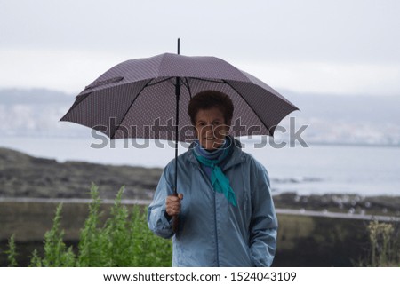 woman with umbrella in autumn