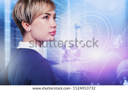 Beautiful young woman programmer standing in data center with double exposure of cyber security interface. Concept of data protection in business. Toned image