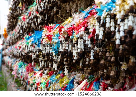 Colorful old garland The hanging wall is a beautiful picture and a creative idea of Thailand people.