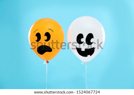 Colorful balloons for Halloween party on blue background