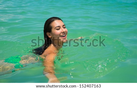 Beautiful young multicultural woman enjoying the beach.