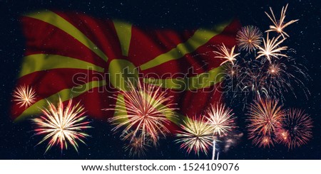Holiday sky with fireworks and flag of Macedonia, independence day of country