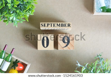 Background Design with number cube strawberry pine apple and wine in natural concept, September 9.