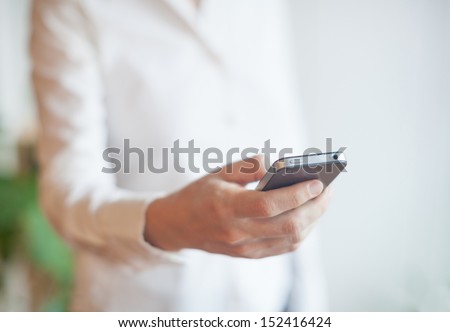 Close up image of woman using a mobile smartphone