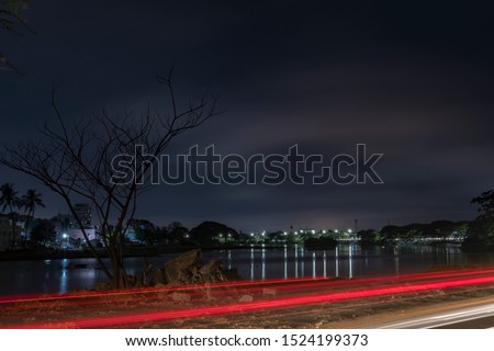 Coimbatore city night view, long exposure night photography with  reflection of lights in pond. 
